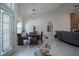 Open dining room with tile floors and modern decor, adjacent to living area at 11036 Bronson Rd, Clermont, FL 34711