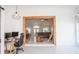 Open interior with a view into the living room that has a fireplace and into the kitchen at 11036 Bronson Rd, Clermont, FL 34711