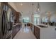 Modern kitchen with stainless steel appliances, sleek cabinets, and a center island at 11036 Bronson Rd, Clermont, FL 34711