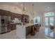 Open concept kitchen with large island, stainless steel appliances, and modern cabinetry at 11036 Bronson Rd, Clermont, FL 34711