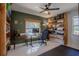 Office features a modern desk, ergonomic chair, and ample shelf space, ideal for organization and productivity at 11036 Bronson Rd, Clermont, FL 34711