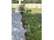 Inviting patio with paved flooring, framed by potted plants and backyard view at 11036 Bronson Rd, Clermont, FL 34711