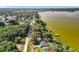 Scenic aerial view of homes bordering a lake, showcasing waterfront living and natural beauty at 1107 Northshore Dr, Eustis, FL 32726