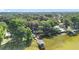 Wide aerial view of waterfront homes with private boat docks, and lush, mature trees at 1107 Northshore Dr, Eustis, FL 32726