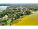 Aerial view of homes along a lakefront with private docks surrounded by lush landscape at 1107 Northshore Dr, Eustis, FL 32726