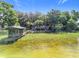 Aerial view of waterfront home with private dock and boat house, showcasing the lakefront property at 1107 Northshore Dr, Eustis, FL 32726
