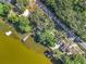 Aerial view of homes along a lake with docks, showcasing their proximity to the water at 1107 Northshore Dr, Eustis, FL 32726