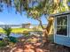 Waterside backyard with scenic lake view and a gazebo in the distance at 1107 Northshore Dr, Eustis, FL 32726