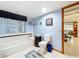 Bathroom with tub and light-blue walls at 1107 Northshore Dr, Eustis, FL 32726