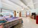 This large bedroom has an adjacent sitting area for relaxing and unwinding at 1107 Northshore Dr, Eustis, FL 32726