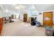 Expansive bonus room with multiple windows and neutral carpeting at 1107 Northshore Dr, Eustis, FL 32726