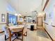 Open dining area featuring high ceilings and easy access to the kitchen and living spaces at 1107 Northshore Dr, Eustis, FL 32726