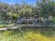 Waterfront home with a private dock surrounded by lush greenery, offering serene lake views at 1107 Northshore Dr, Eustis, FL 32726