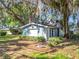 Charming home featuring neat landscaping and architectural detail at 1107 Northshore Dr, Eustis, FL 32726