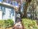 Charming home exterior with lush landscaping and a view of a gazebo near the water at 1107 Northshore Dr, Eustis, FL 32726