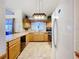 This kitchen has ample cabinets, counterspace, and updated appliances at 1107 Northshore Dr, Eustis, FL 32726