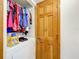 Cozy laundry area with a white washing machine and storage space at 1107 Northshore Dr, Eustis, FL 32726