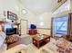 Cozy living room featuring a decorative fireplace, a TV, and a sunroom at 1107 Northshore Dr, Eustis, FL 32726
