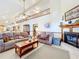 Inviting living room with vaulted ceiling, cozy fireplace, and open layout at 1107 Northshore Dr, Eustis, FL 32726