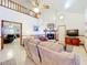 Spacious living room featuring vaulted ceiling, cozy fireplace, and comfortable seating at 1107 Northshore Dr, Eustis, FL 32726