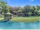 Lakefront home boasts a private dock with a gazebo and lush green surroundings offering serene waterfront living at 1107 Northshore Dr, Eustis, FL 32726