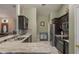 A stylish kitchen boasts granite counters, mosaic backsplash, and stainless steel appliances at 11437 Alameda Sandra Dr, Clermont, FL 34711