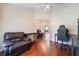 Spacious living room with hardwood floors and comfortable seating offers a welcoming atmosphere at 11437 Alameda Sandra Dr, Clermont, FL 34711