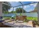 Relaxing patio features a charming stone water feature and serene outdoor retreat at 11437 Alameda Sandra Dr, Clermont, FL 34711
