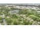 Aerial view of neighborhood with mature trees and townhouse community nearby at 121 Mason Park Dr, Daytona Beach, FL 32117