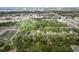 Aerial view of neighborhood featuring mature trees, homes, and cityscape in background at 121 Mason Park Dr, Daytona Beach, FL 32117