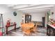 Dining room featuring wood floors, table with four chairs, and beamed ceilings at 121 Mason Park Dr, Daytona Beach, FL 32117
