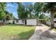 Charming single story home with a large front yard and a covered driveway, perfect for parking and protection from the elements at 121 Mason Park Dr, Daytona Beach, FL 32117
