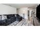Modern living room with a plush couch and stylish decor, creating a cozy atmosphere at 121 Mason Park Dr, Daytona Beach, FL 32117