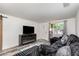 Comfortable living room featuring a decorative fireplace and a cozy couch, perfect for relaxation at 121 Mason Park Dr, Daytona Beach, FL 32117