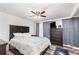 Spacious main bedroom with a ceiling fan, neutral decor, and natural light from the window at 121 Mason Park Dr, Daytona Beach, FL 32117
