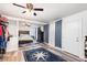 Nautical themed main bedroom featuring planked ceilings, ceiling fan and blue compass rug at 121 Mason Park Dr, Daytona Beach, FL 32117