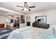 Spacious main bedroom featuring a ceiling fan, a dresser and walk-in closet at 121 Mason Park Dr, Daytona Beach, FL 32117