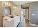 Bathroom featuring a double vanity with marble countertops and tile flooring at 1226 Overlook Rd, Eustis, FL 32726
