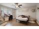 Cozy bedroom featuring a desk, ceiling fan, and wood-look tile flooring at 1226 Overlook Rd, Eustis, FL 32726