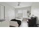 Bedroom with tile floors, a window with blinds, and a bed next to a closet at 1226 Overlook Rd, Eustis, FL 32726