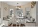 Cozy breakfast nook with a built-in banquette seating area surrounded by windows at 1226 Overlook Rd, Eustis, FL 32726