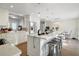 Bright kitchen featuring an island with stool seating, stainless steel appliances, and ample counter space at 1226 Overlook Rd, Eustis, FL 32726