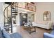Spacious living room featuring a spiral staircase, fireplace, and comfortable seating at 1226 Overlook Rd, Eustis, FL 32726