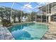 Inviting screened pool area with waterfront views, perfect for relaxation and entertainment at 1226 Overlook Rd, Eustis, FL 32726