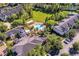 Aerial view showcases the community pool, lush landscaping, and well-maintained buildings at 130 Southern Pecan Cir # 204, Winter Garden, FL 34787