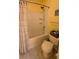 The bathroom features a tub with a shower, providing a convenient and relaxing space for personal care at 130 Southern Pecan Cir # 204, Winter Garden, FL 34787