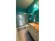 Bathroom featuring a glass enclosed shower, vanity with cabinets, sink, and a mirror at 130 Southern Pecan Cir # 204, Winter Garden, FL 34787
