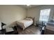 Bedroom with hardwood flooring, natural light, and working space at 130 Southern Pecan Cir # 204, Winter Garden, FL 34787