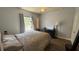 Bedroom with hardwood flooring, natural light, and ceiling fan at 130 Southern Pecan Cir # 204, Winter Garden, FL 34787