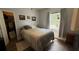 Serene bedroom featuring a comfortable bed, ample natural light, and closet space at 130 Southern Pecan Cir # 204, Winter Garden, FL 34787